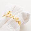 Conjunto-4-Aneis-para-Guardanapos-de-Zinco-e-Metal-Love-Dourado-4cm-x-2cm-x-4cm-Wolff