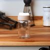 Saleiro-Pimenteiro-com-Tampa-Rotativa-Siena-100ml-Bege-Vidro-Lyor